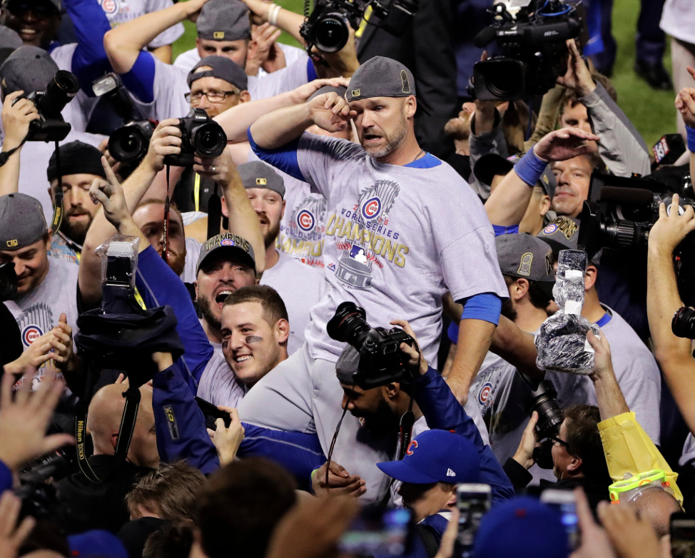 David Ross carried by his teammates. Photo taken by Gene J. Puskar of The Associated Press and appeared on nytimes.com